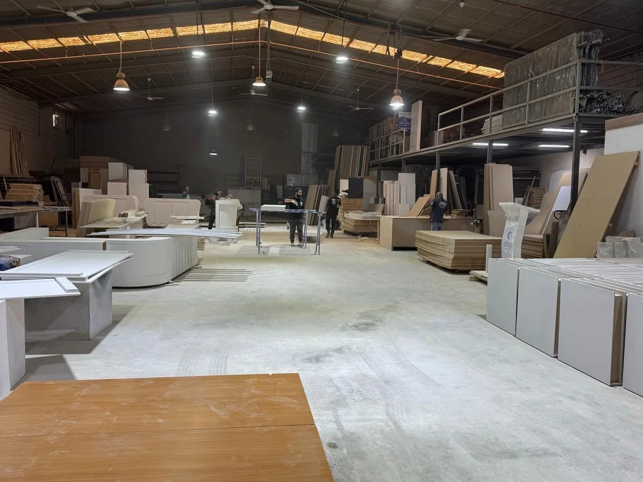 Finishing a long white component on trestles
